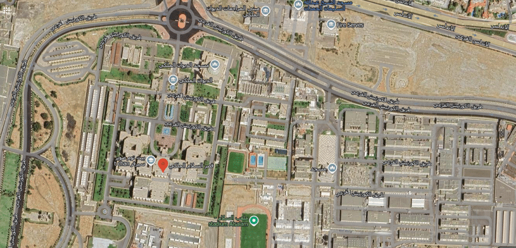 An aerial view of Jeddah, highlighting the Salam Palace, a royal residence in the western region. The palace is situated on a peninsula surrounded by the Red Sea and features an architectural design that blends Islamic motifs with Mediterranean influences, including lush inner gardens and opulent buildings. The location underscores Jeddah's significance as a diplomatic and strategic hub.