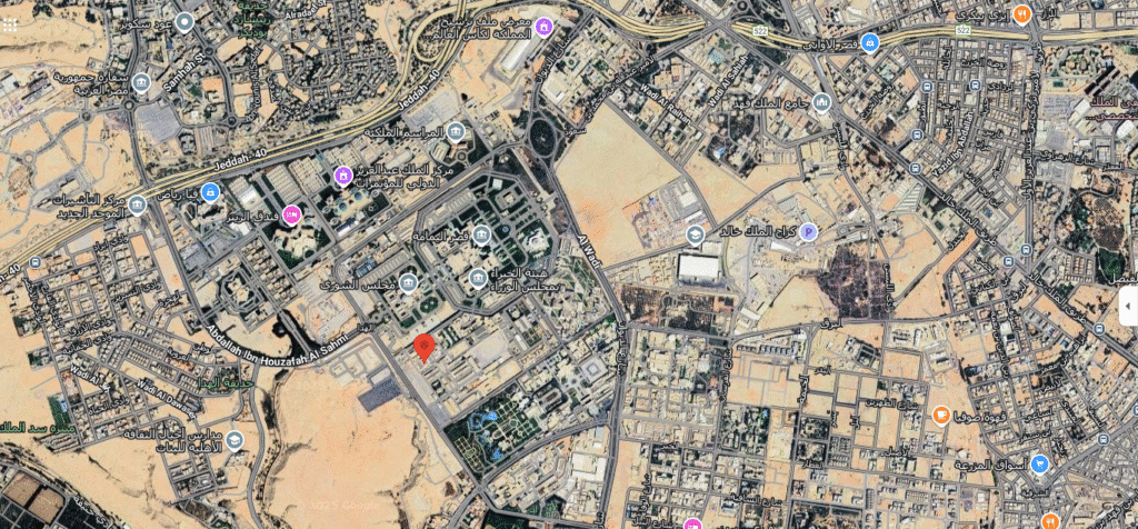  An aerial view of Riyadh, highlighting the historic Imam Palace, one of the earliest royal palaces in the Kingdom. The palace is located near the iconic Al-Masmak Fortress and features traditional Najdi architecture that reflects the cultural identity of the region. Surrounding buildings and roads illustrate the city's urban development.