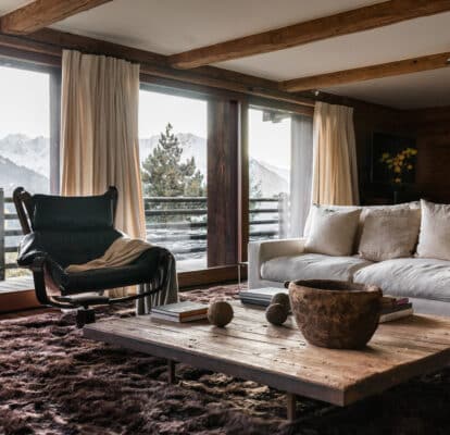 Cozy sitting corner featuring Belgian linen sofa and sustainable decor.

