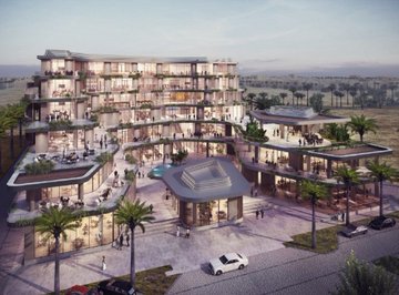 Concept rendering of the Soho Square project, a mixed-use development located along Jeddah's waterfront. The modern design features open terraces and balconies overlooking the sea, with restaurants, cafes, outdoor seating areas, and landscaped zones with palm trees.
