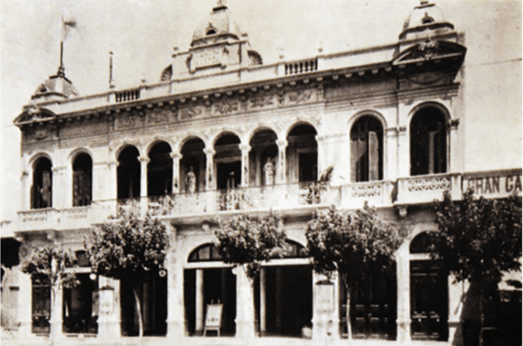 The Marconi Theatre on a sunny day, highlighting its elegant design with arches and large windows.
