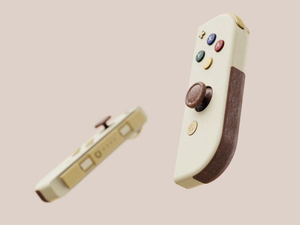 وحدة تحكم لجهاز Nintendo Switch مصنوعة من مواد طبيعية، تتميز بأزرار ملونة وأجزاء مصنوعة من ألياف جوز الهند.