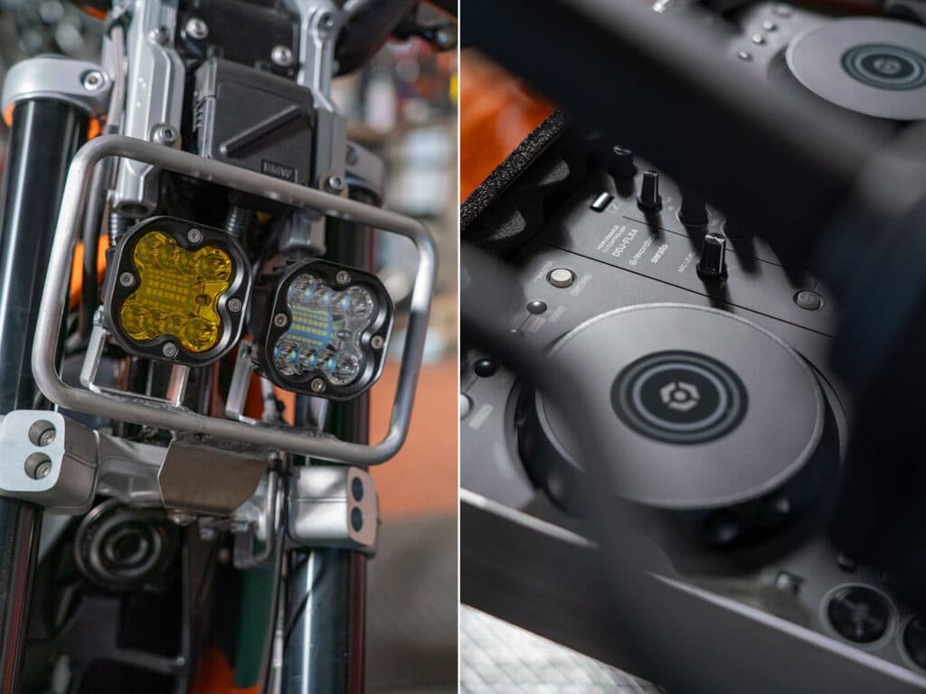 Close-up details of the BMW DE-02 electric motorcycle, showcasing bright neon headlights and an integrated turntable unit in the rear section.