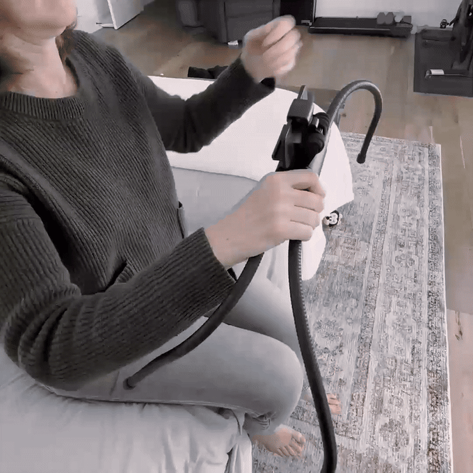 User comfortably using a tablet in bed with a stable adjustable stand