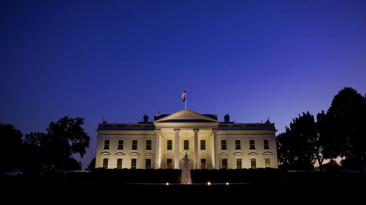 The White House facade representing federal authority on construction project permits.