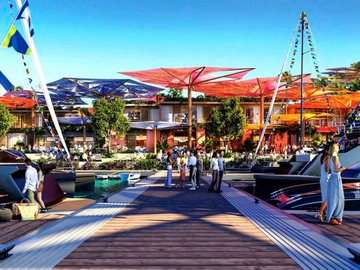 A wooden walkway leading to a vibrant entertainment area at a luxury resort, adorned with colorful canopies and surrounded by trees and flowers. People are walking along the path, creating a lively and enjoyable atmosphere.