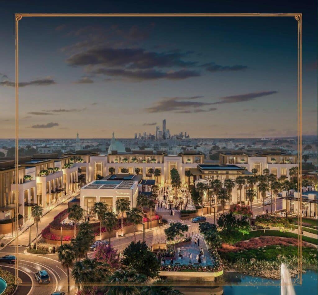 A nighttime view of the entertainment complex at Oud Reserve with premium restaurants, green gardens, and stunning architectural designs.