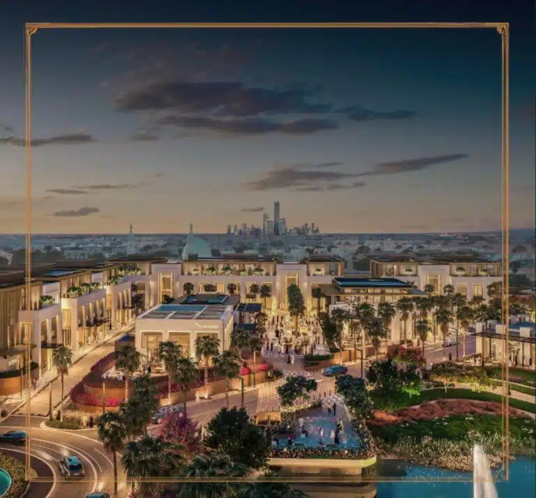 A nighttime view of the entertainment complex at Oud Reserve with premium restaurants, green gardens, and stunning architectural designs.