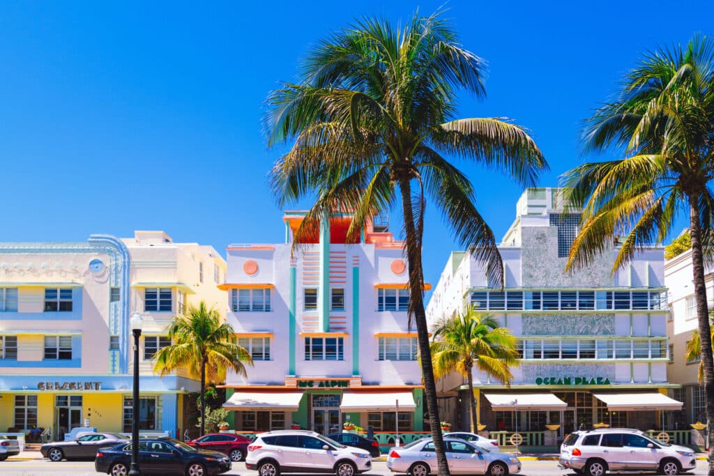 A classic Art Deco hotel in Miami Beach with symmetrical design, vertical lines, and pastel colors