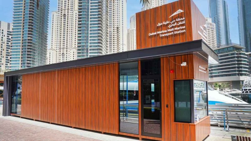 Front facade of the Dubai Marina Mall Marine Transport Station with a sleek wooden finish