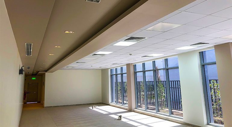 Ornamental gypsum arches and columns at the entrance of a traditional Saudi home.