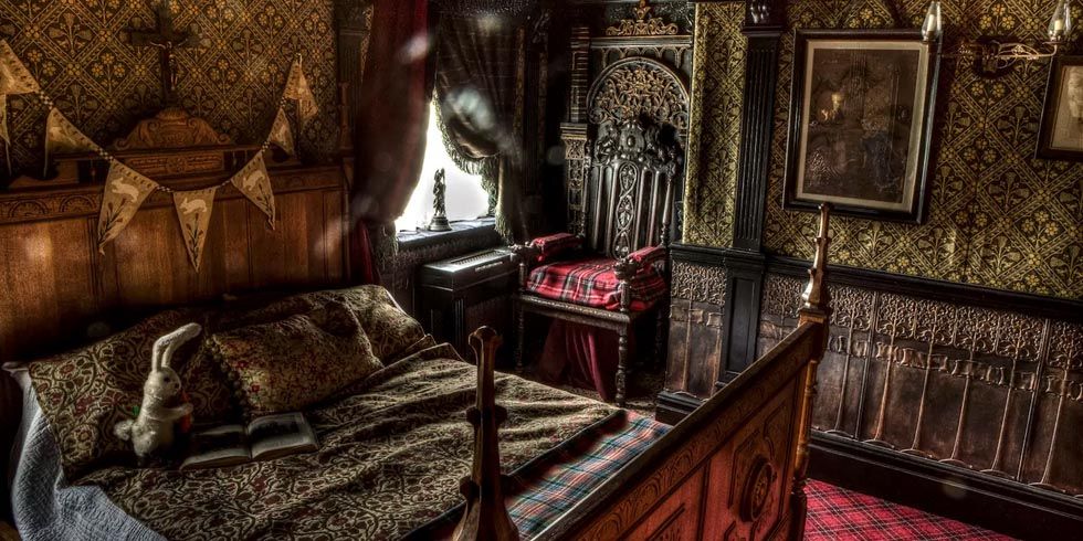 An old room with vintage furniture and dark shadows that create a mysterious, eerie atmosphere.