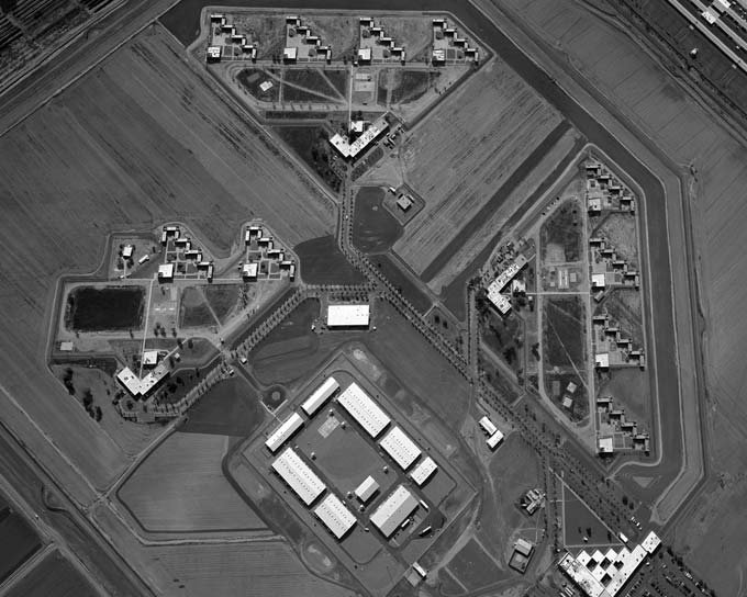 Aerial image of a U.S. prison with dense architecture and angular design limiting free movement inside the complex.