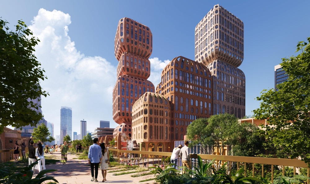 Daytime view of the Hatai project in Bangkok, featuring lantern-inspired towers surrounded by green public spaces.