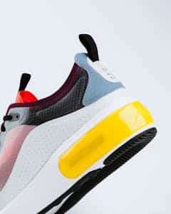 Vibrant and trendy sneaker showcasing a bold design against a white background.