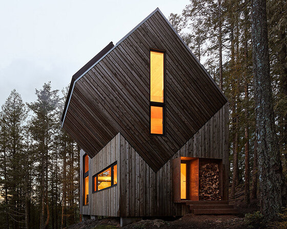The Nest&rsquo;s wooden fa&ccedil;ade nestled among dense forest on Keats Island