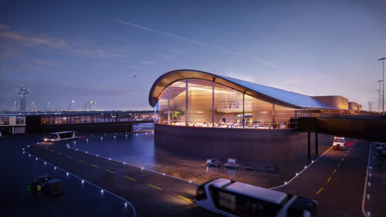 صورة تُظهر الواجهة الخارجية لـ Concourse D بمطار أوهير مع واجهة زجاجية منحنية.