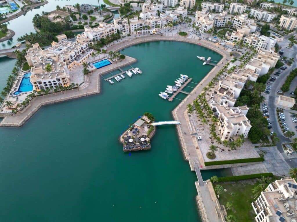 Aerial view of Hawana Salalah’s marina and integrated coastal resort