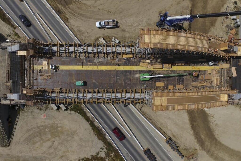 Close-up drone view of multiple precast girders forming the superstructure of Avenue 88 grade separation.