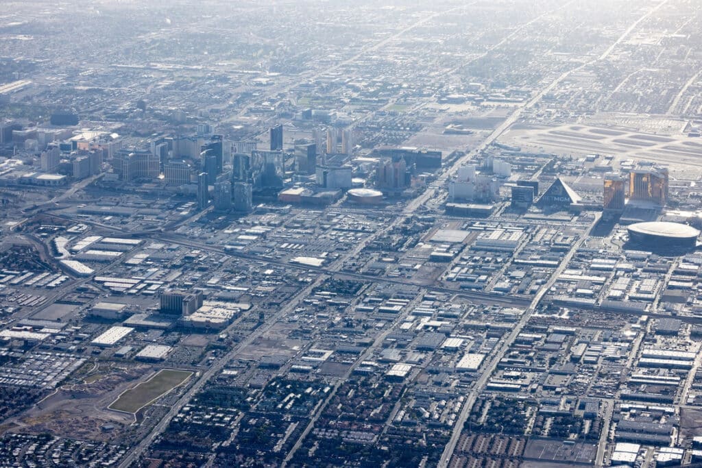Aerial shot capturing the road grid and building density in central Las Vegas.