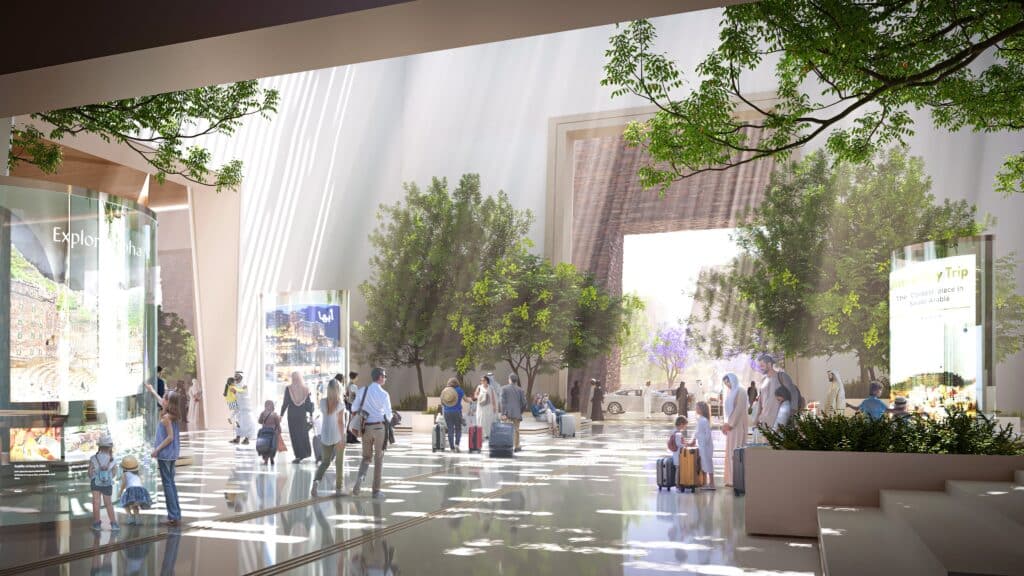 منطقة الوصول في مطار أبها الجديد، حيث تسلط أشعة الشمس على المسافرين وسط المساحات الخضراء الداخلية.