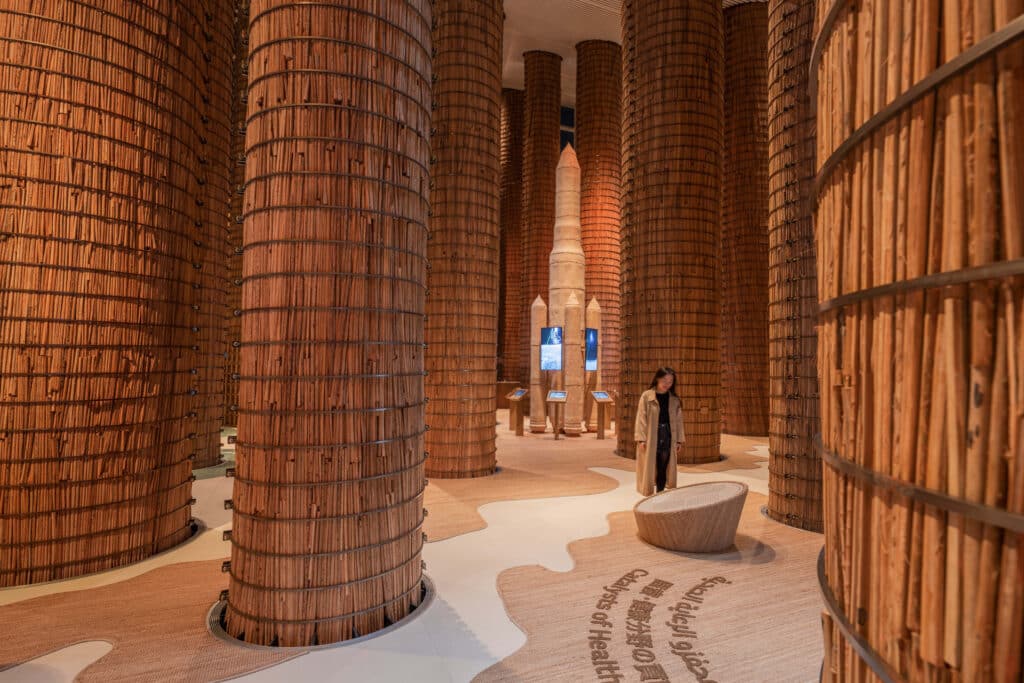 Interior design of the UAE Pavilion featuring vertical columns with a monumental presence