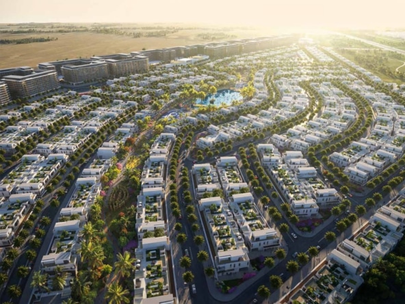 مشهد بانورامي لمجمع عمراني في دبي يعكس التناغم بين المباني السكنية والطبيعة المحيطة.