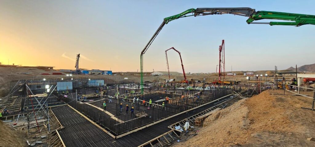 Construction equipment and pipelines at Muscat&rsquo;s water project during sunset