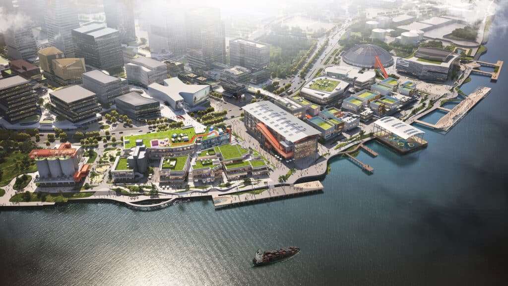 Aerial view of the entire site along the Huangpu River showing the integration of public spaces and repurposed structures