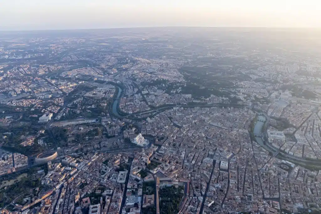 Panoramic aerial image showing the city&rsquo;s edge blending into the surrounding desert.