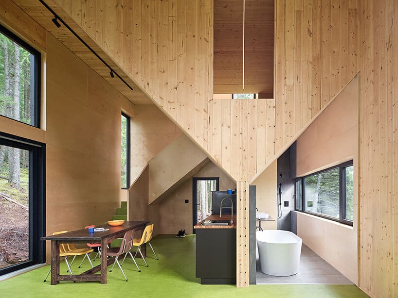 Aerial view showing The Nest seamlessly integrated within dense forest