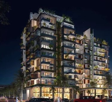 Night view of Garden Tower fa&ccedil;ade with exterior lighting highlighting architectural lines