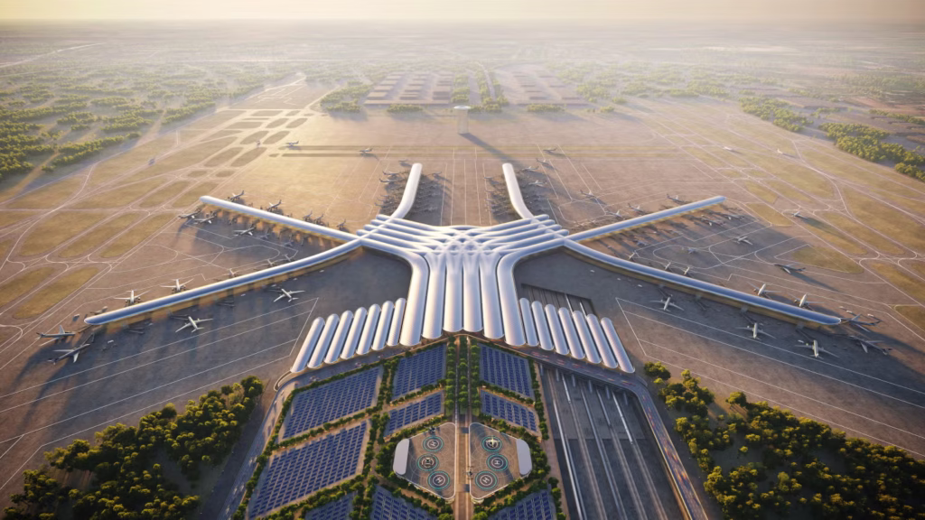 Aerial view of the planned CPK airport west of Warsaw showing the centralized terminal layout