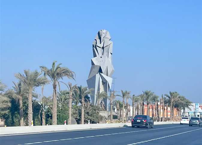 Contemporary pharaonic statue at the Grand Egyptian Museum entrance, showing sharp geometric details under daylight.