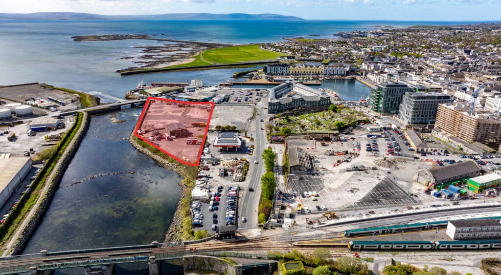 Design rendering showing multi-storey buildings surrounding a public plaza in the Amharc Atalia project