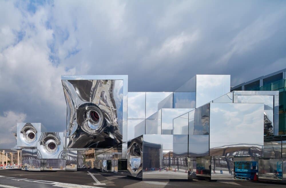 Architectural view of the pavilion showcasing its reflective geometric structure