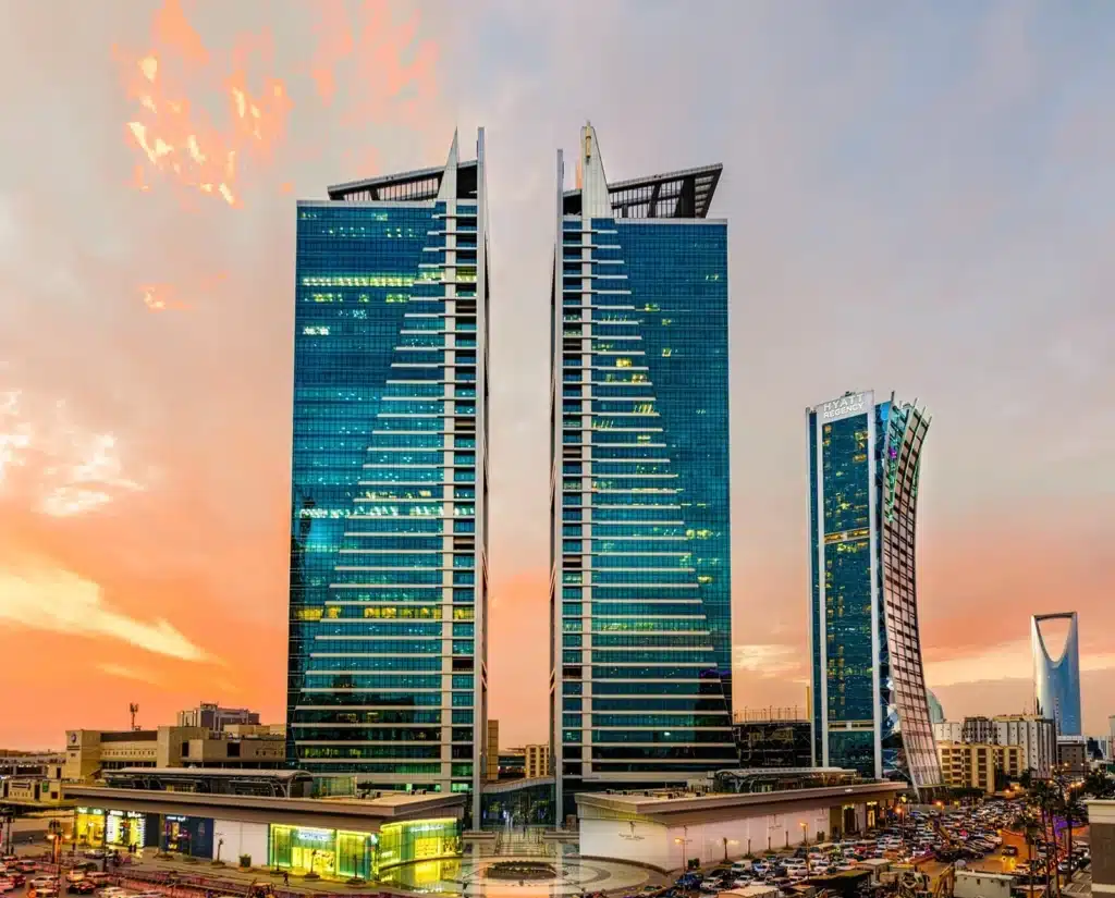 Olaya Towers at sunset with glass façades reflecting golden light