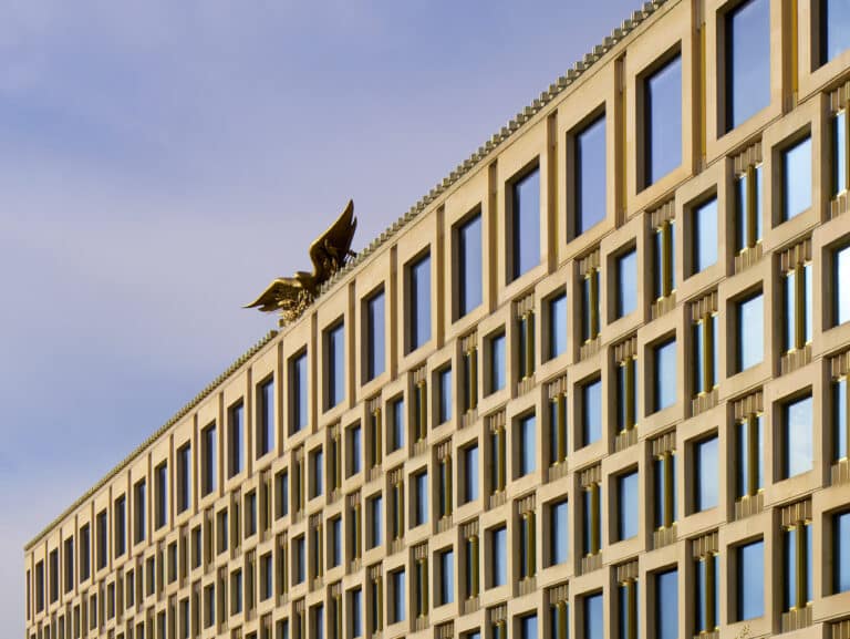 Side façade of The Chancery Rosewood Hotel, featuring rectangular windows and clear architectural lines.