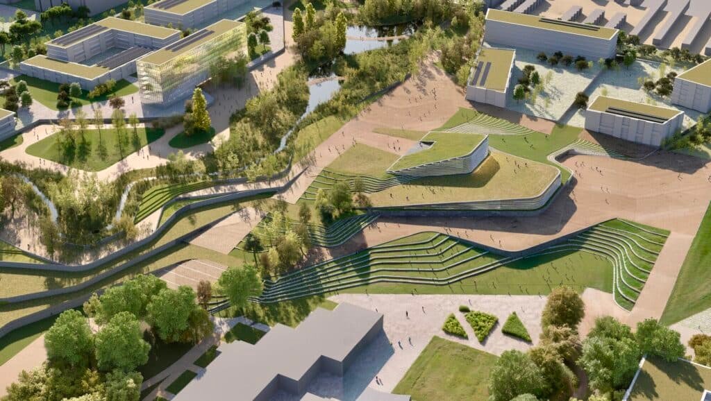 مشهد جوي لمشروع DAT Alierta: أسطح خضراء، طرق متعرجة، وحدائق مدرجة تدمج الطبيعة مع العمارة الحديثة.