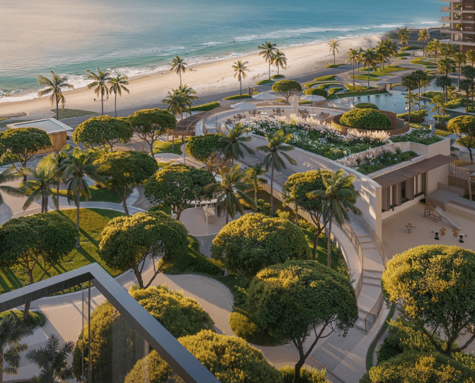 حدائق خضراء مُرتبة في سوتو غراندي بألمحرا، تضم ممرات منحنية، أشجارًا استوائية، أرضيات عشبية مُعتنى بها، ومناظر خلابة للشاطئ وخليج العرب.