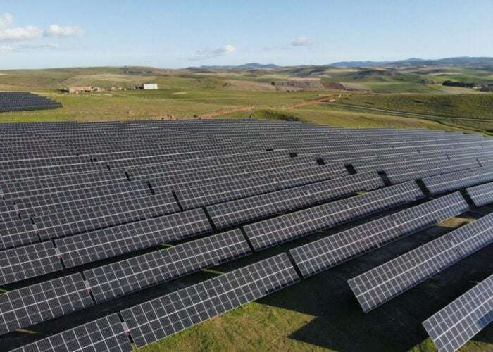 Solar plant nestled within open agricultural land