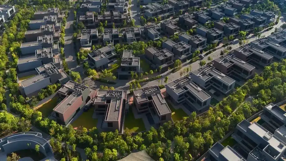 General view of Masaar 3 residential community with green areas and pathways.