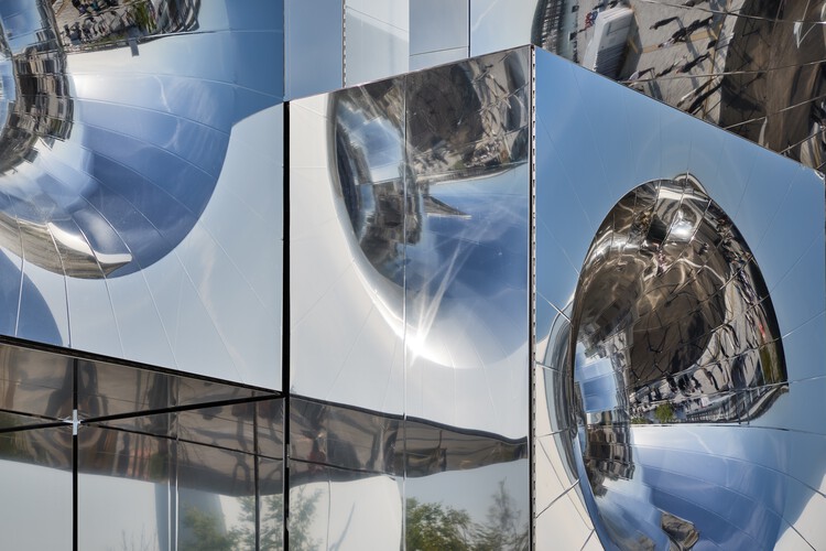 Panoramic design of the pavilion highlighting the interplay of form and reflection