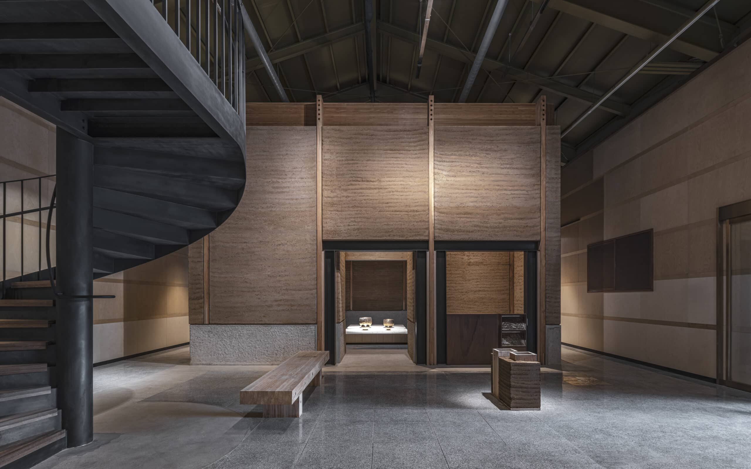 Bangjja Yugi Museum interiors featuring earth built walls and timber details