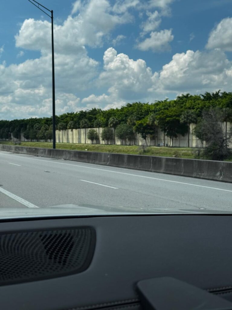 A fragmented urban horizon created by a series of uniformly colored walls with different heights.