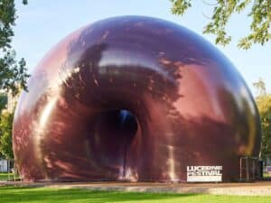 Ark Nova music hall from the outside, showing the unique purple inflatable structure