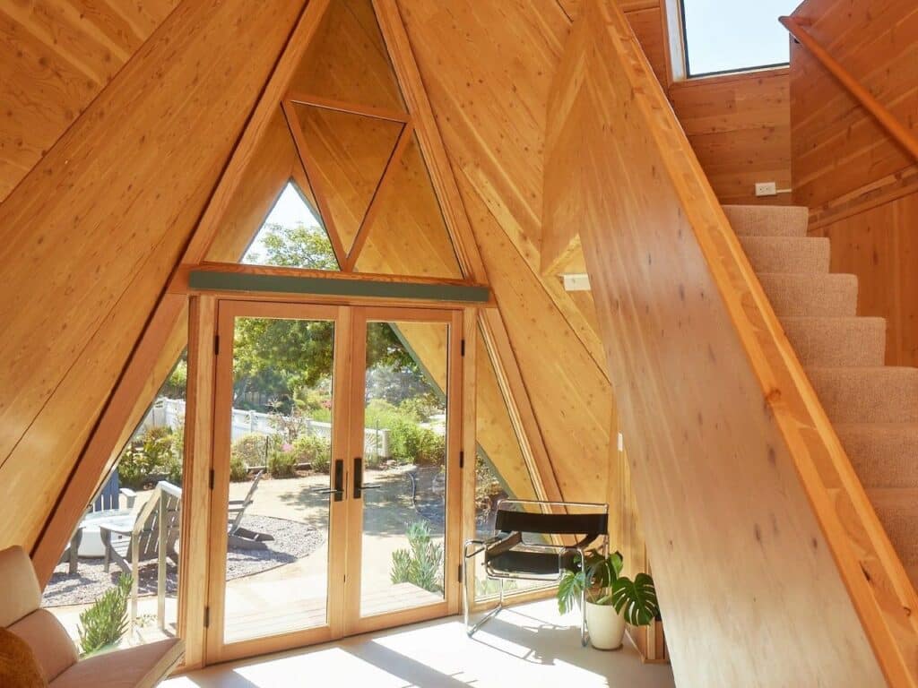 Tetra-One origami-inspired home exterior in La Jolla backyard, reflecting California sunlight