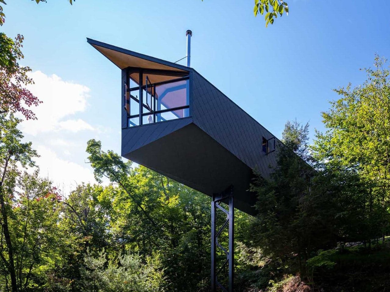 MORE Cabin suspended among the trees with a forest view