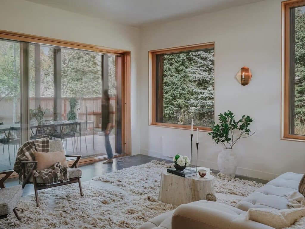 Bright interior space in Freya House with natural daylight and wooden-framed windows