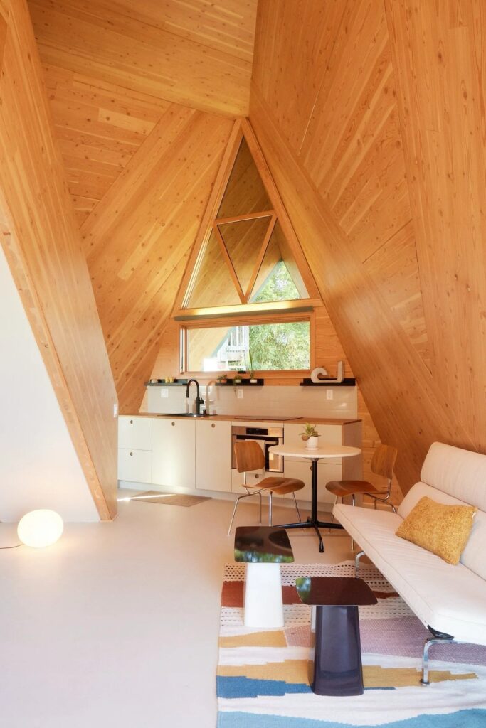 Tetra-One origami-inspired home exterior in La Jolla backyard, reflecting California sunlight